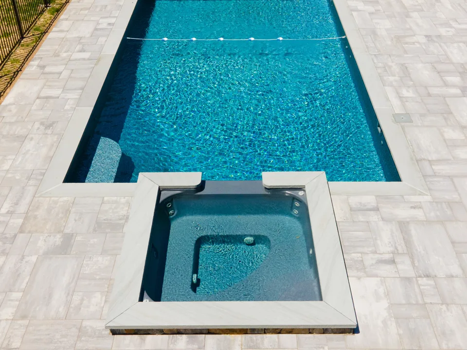 Aerial — the same pool and spa finished, bluestone deck complete — Exterior Services LLC, Wilton, CT