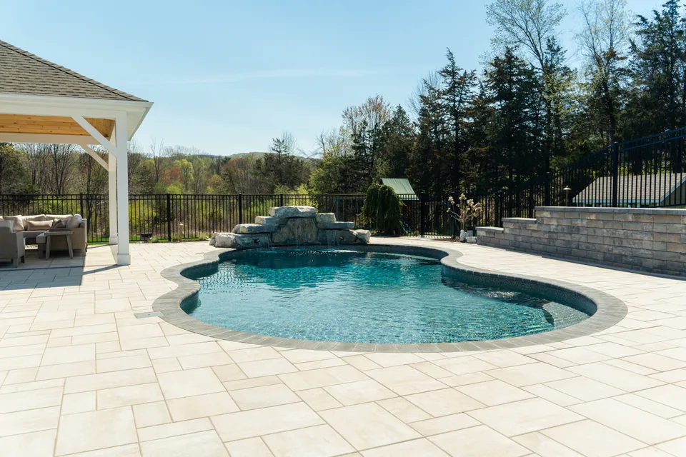 The same yard finished — pool, boulder waterfall and pavilion — Exterior Services LLC, Stormville, NY