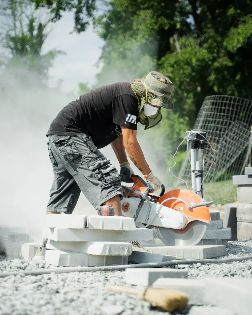 Cutting pavers in the saw dust — Exterior Services LLC, Stormville, NY