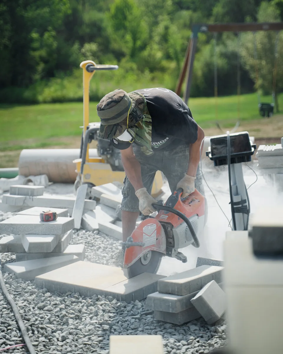 Cutting and setting pavers — saw dust, string lines, hand work — Exterior Services LLC, Stormville, NY