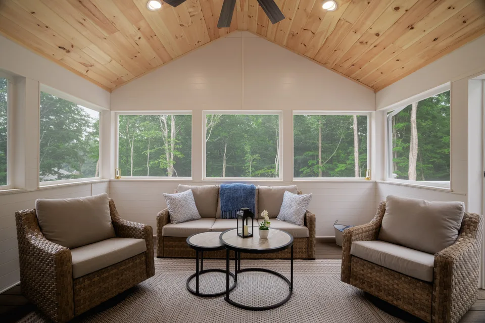 Screened porch with cathedral pine ceiling and wicker seating — Exterior Services LLC, Ridgefield, CT
