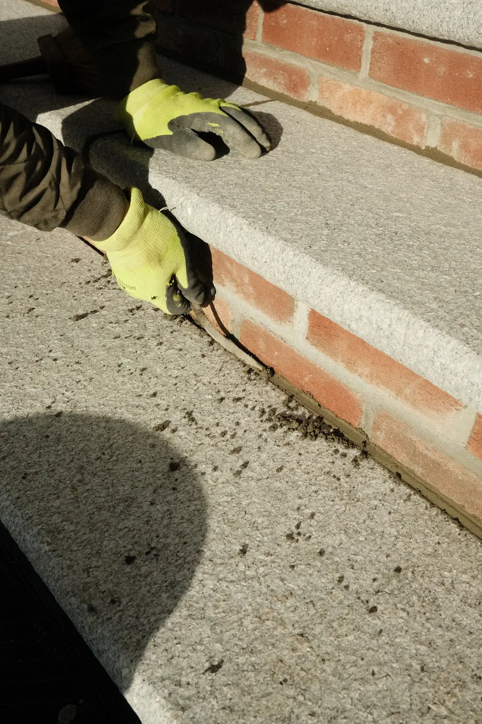 Setting the new granite and bluestone entrance stair — Exterior Services LLC, Ridgefield