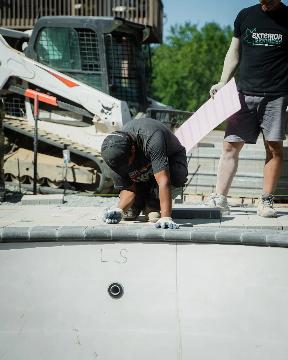 Carrying coping with the skid steer — Exterior Services LLC, Stormville, NY