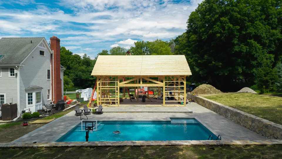 Timber-frame pool house raised over the finished pool — Exterior Services LLC, Bethel, CT