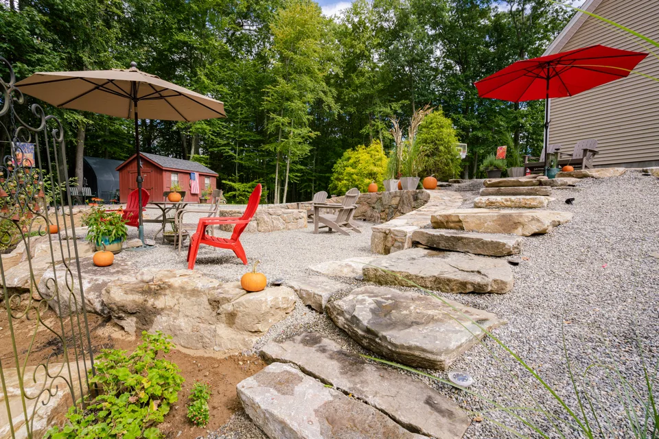 Ledge-stone patio, fire area and seating — Exterior Services LLC