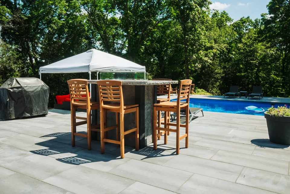 Patio dining set above the pool — Exterior Services LLC, Danbury, CT