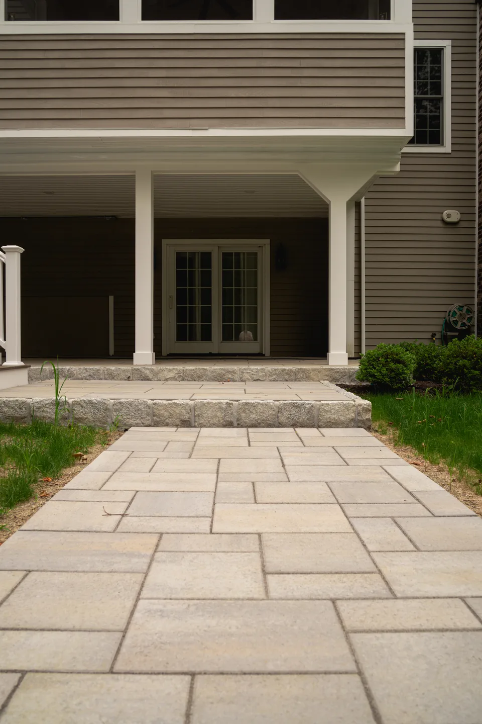Paver walkway and granite step to a covered patio — Exterior Services LLC, Ridgefield, CT