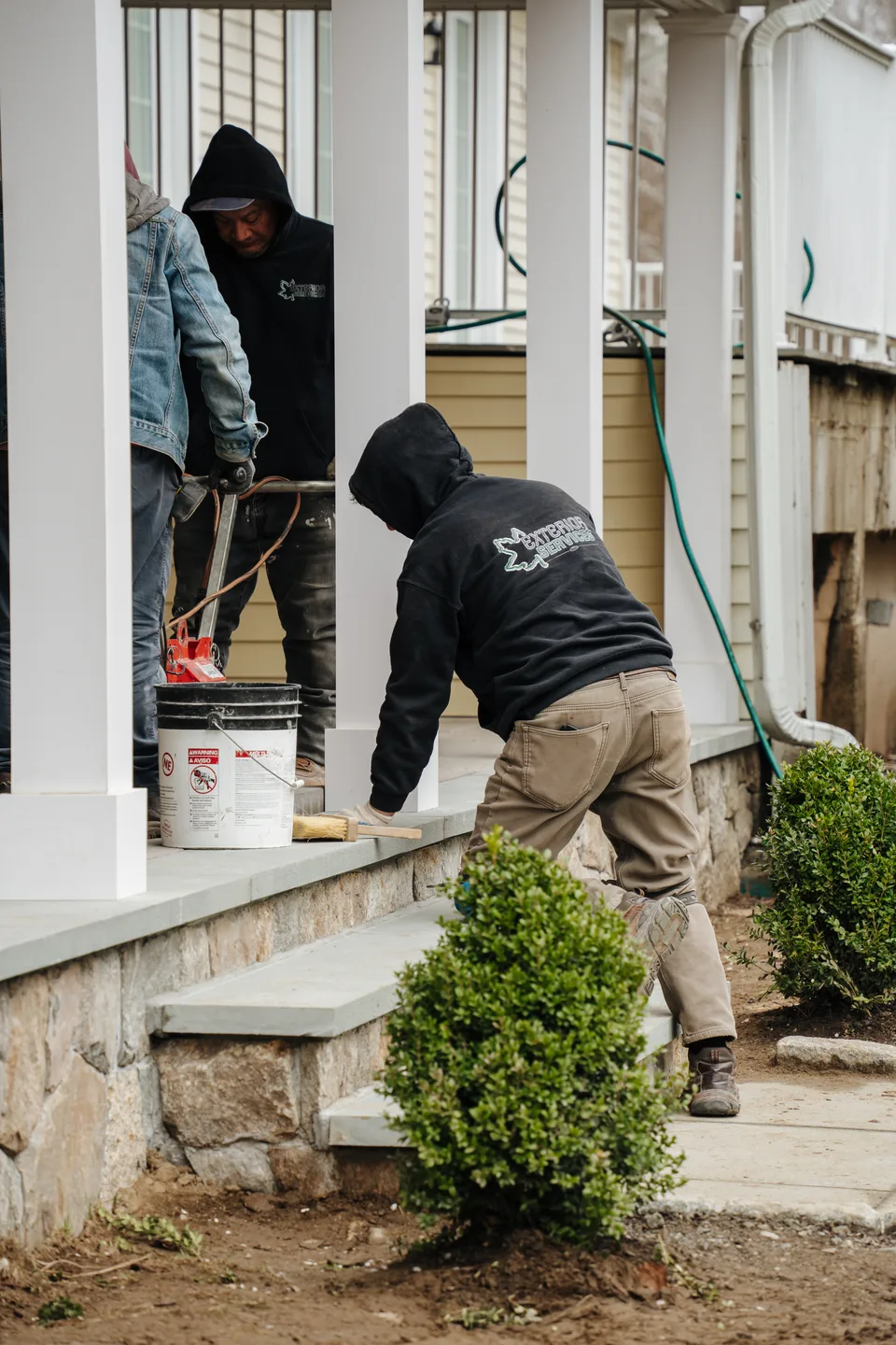 Setting and sealing the stone entrance steps — Exterior Services LLC