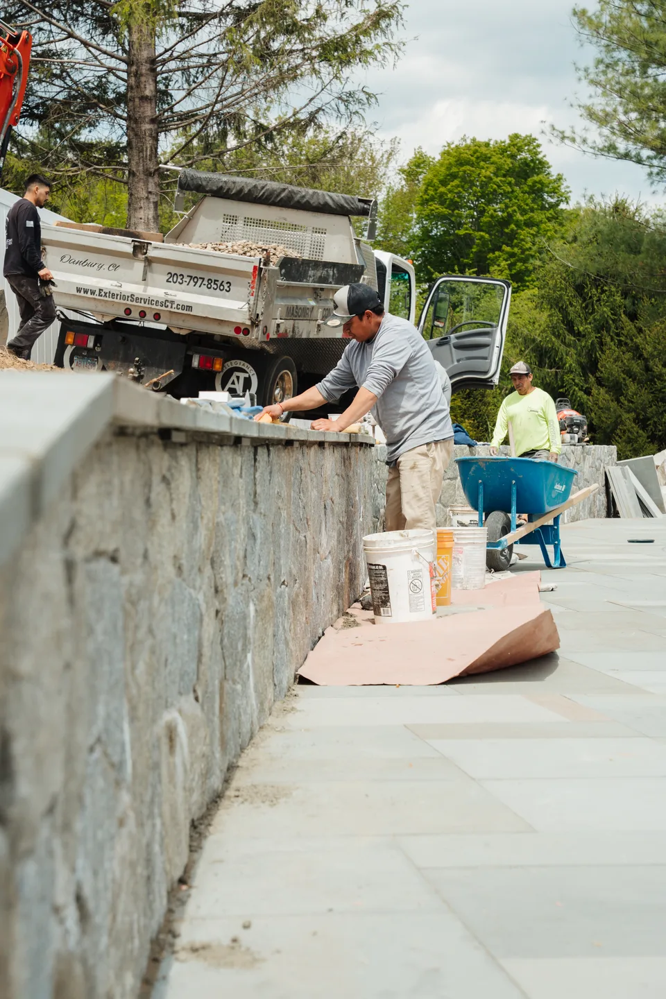 Cleaning the bluestone cap, dump truck behind — Exterior Services LLC, Newtown, CT