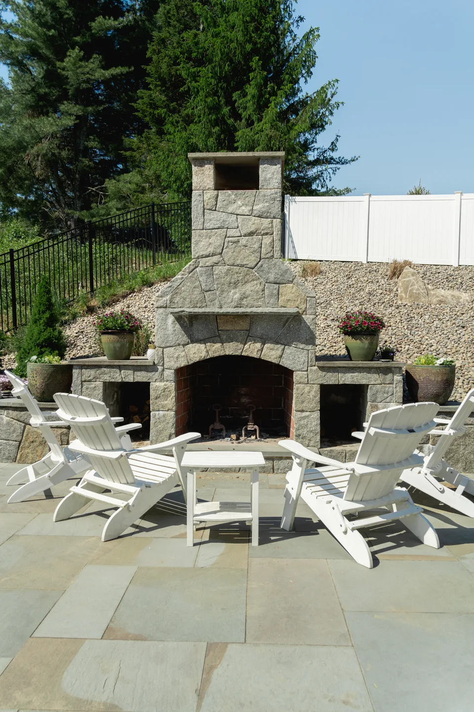 Fieldstone outdoor fireplace with adirondack chairs — Exterior Services LLC, Newtown, CT