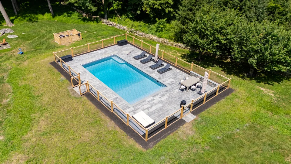 Aerial — rectangular pool, bluestone deck, cedar and wire fence — Exterior Services LLC, Redding, CT