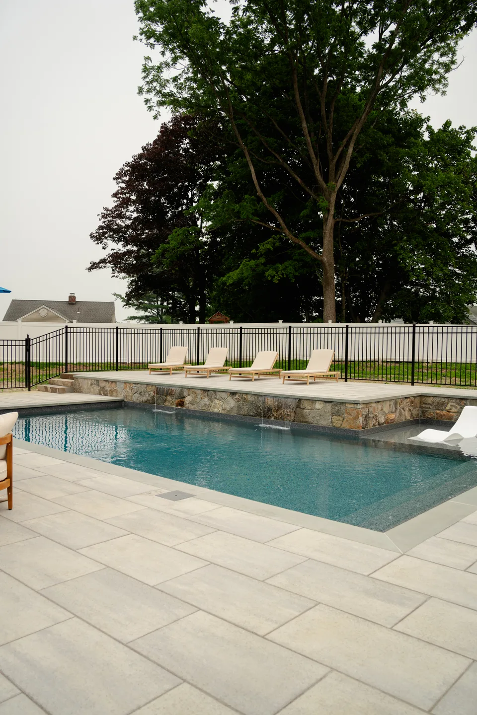 Pool and raised spa with the scupper wall — Exterior Services LLC, Brookfield, CT