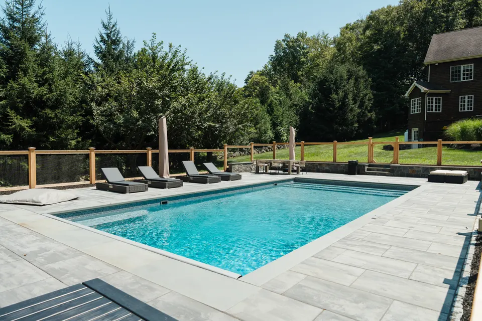Pool and deck, turquoise water, loungers — Exterior Services LLC, Redding, CT
