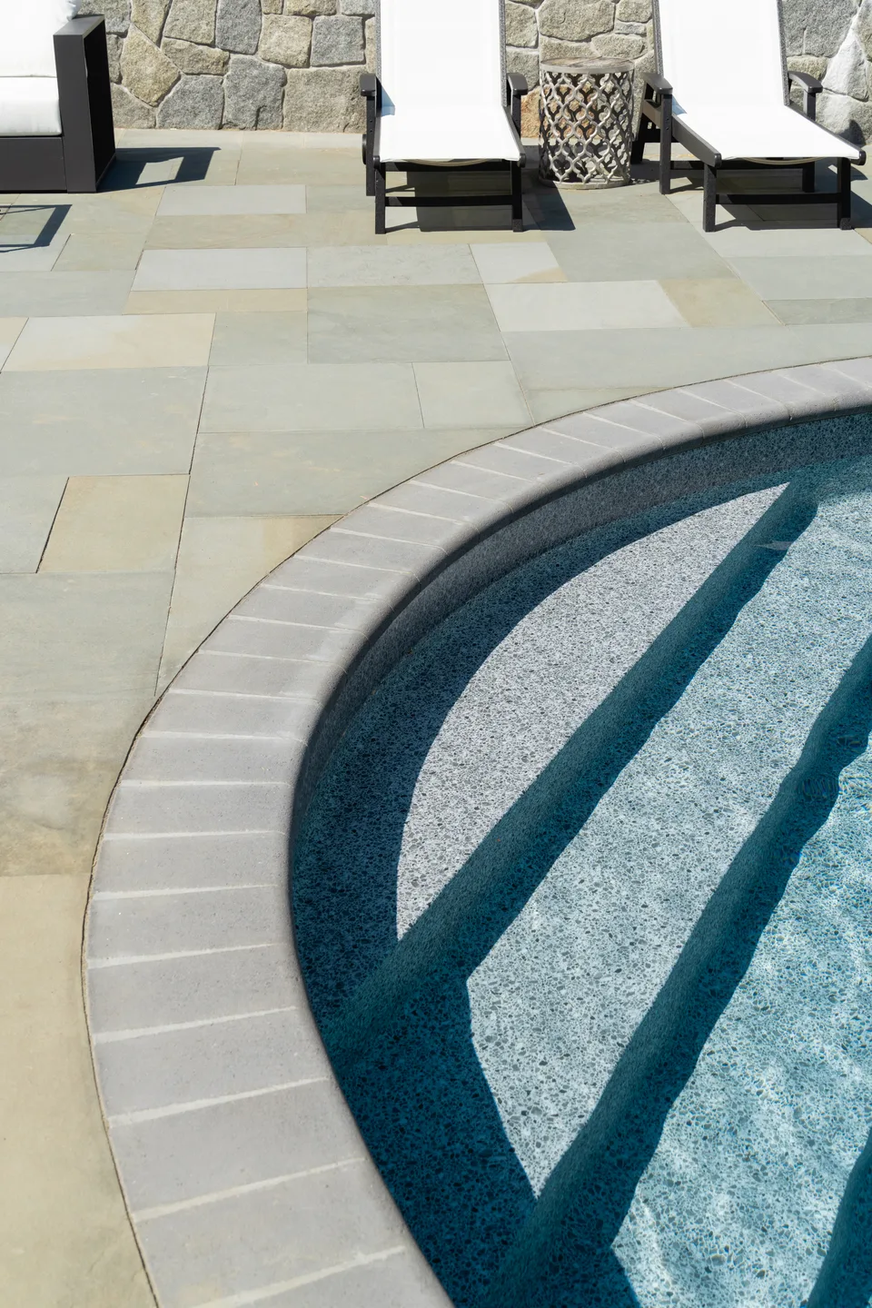 Pool entry steps and coping against a bluestone deck — Exterior Services LLC, Newtown, CT