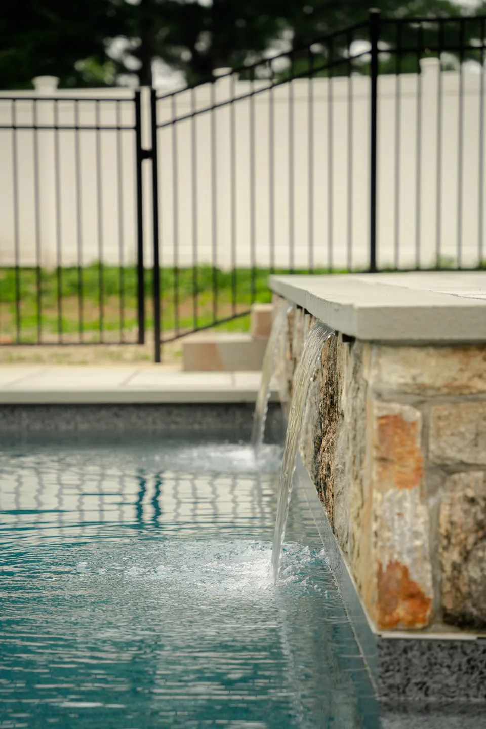 Scupper arc off the stone veneer pillar — Exterior Services LLC, Brookfield, CT