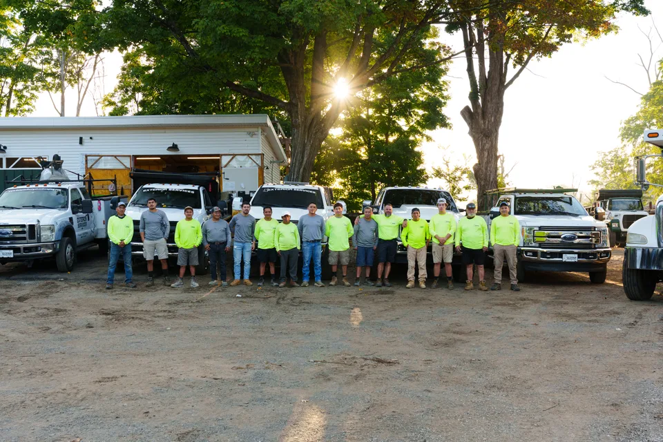 The crew lined up with the fleet at the shop — Exterior Services LLC, New Milford, CT