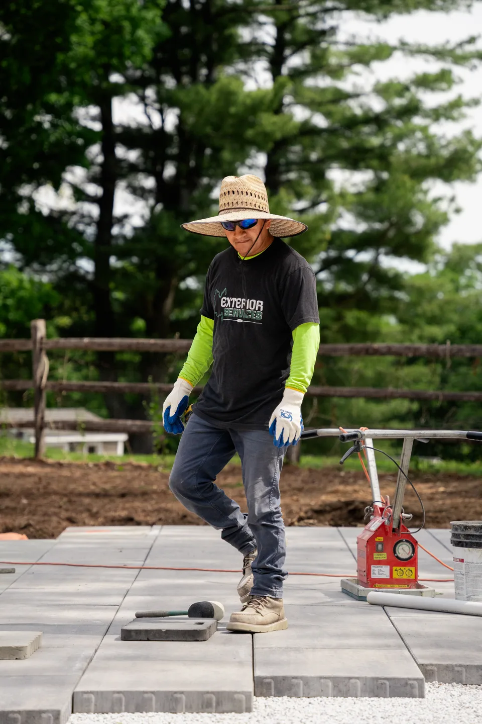 Running the plate compactor along the coping run — Exterior Services LLC, Brookfield, CT